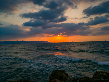 Scenic view of sea against sky during sunset