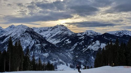 Scenic view of snowcapped mountains against sky during winter