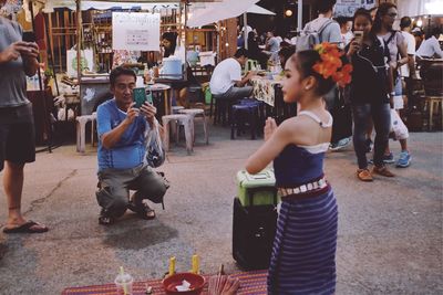 Group of people at street market in city