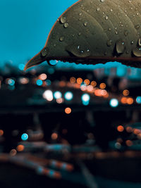 Defocused image of illuminated wet city during rainy season