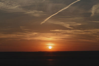 Scenic view of sea against romantic sky at sunset