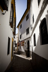 Alley amidst buildings in city