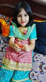 Portrait of a smiling girl sitting