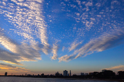 Scenic view of cityscape against sky at night