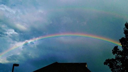 Low angle view of rainbow in sky