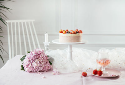 Cake and flowers on table during celebration
