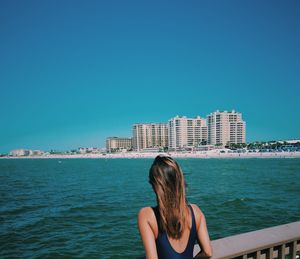 Rear view of woman looking at sea