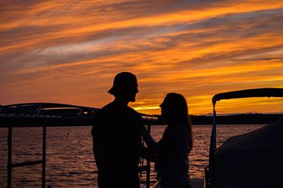 Silhouette of people at sunset