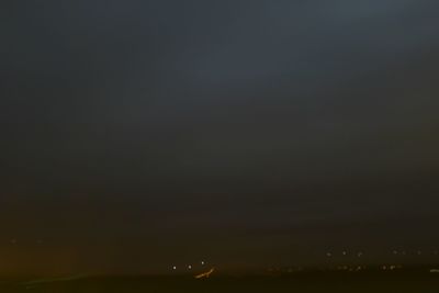 Scenic view of landscape against sky at night