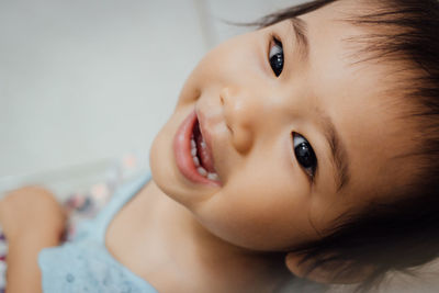 Close-up portrait of baby at home