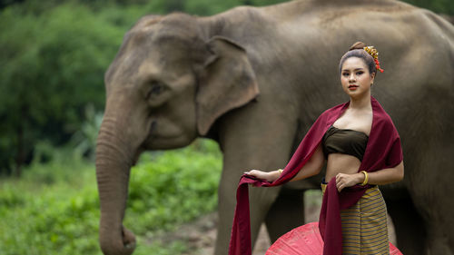 Portrait of girl ind front of elephant