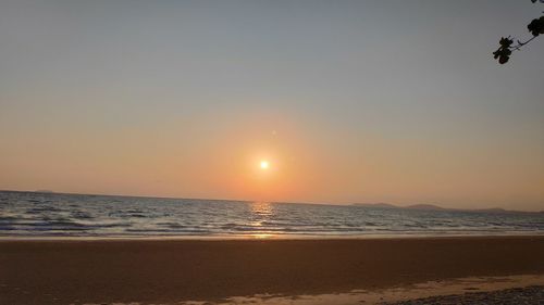 Scenic view of sea against clear sky during sunset