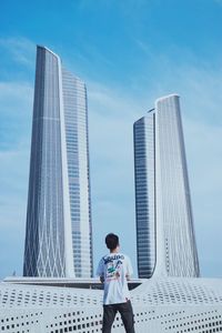 Low angle view of modern office buildings against sky