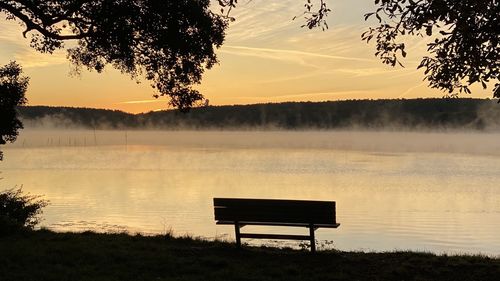 Scenic view of lake against sky during sunset