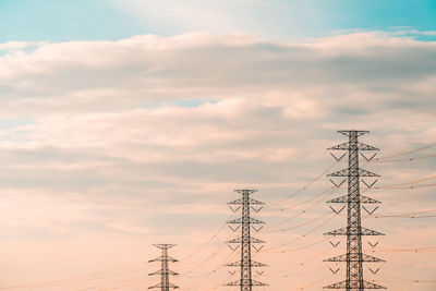 Low angle view of electricity pylon against sky