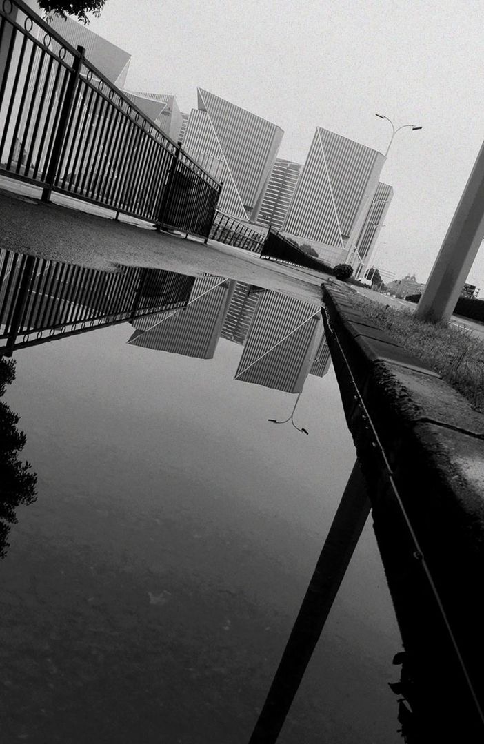 architecture, reflection, building exterior, water, city, no people, built structure, outdoors, skyscraper, sky, day