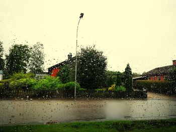 Water splashing in park against clear sky