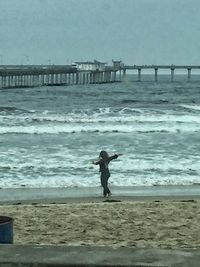 Side view of silhouette people on beach