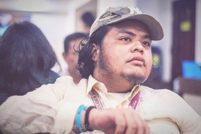 Portrait of young man sitting outdoors