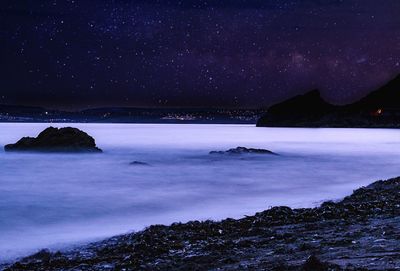 Scenic view of sea against sky at night