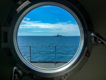 Scenic view of sea seen through window