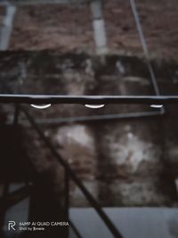 Close-up of sign on metal fence