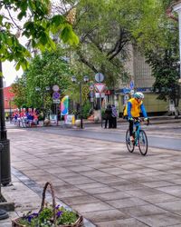 People on bicycle in city