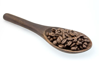 Close-up of coffee beans against white background