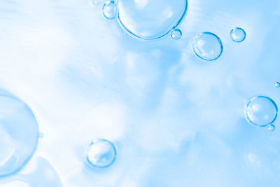 Low angle view of bubbles against sky