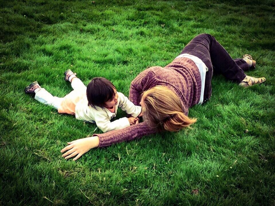 TWO DOGS ON GRASSY FIELD