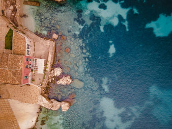 High angle view of swimming pool by building