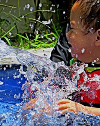 Close-up portrait of a boy in water