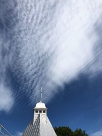 High section of white building against blue sky