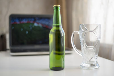 Close-up of wine bottles on table