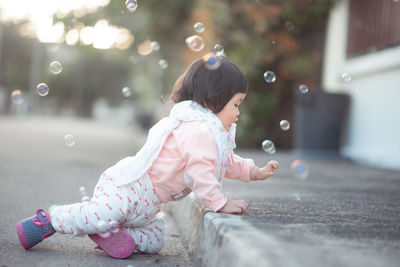 Girl sitting outdoors