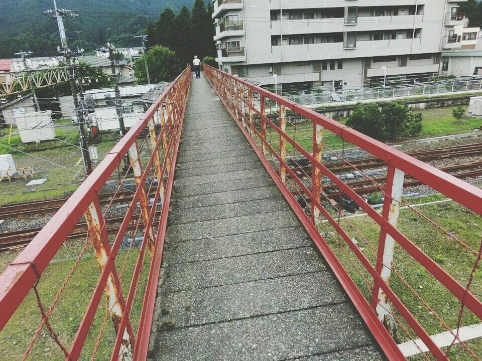 HIGH ANGLE VIEW OF STEPS BY CITY