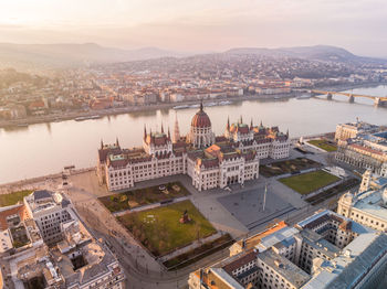 Aerial shot of the hungarian parliament building and the danube river in budapest cityscape 