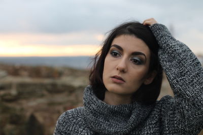 Close-up of thoughtful woman wearing warm clothing during winter