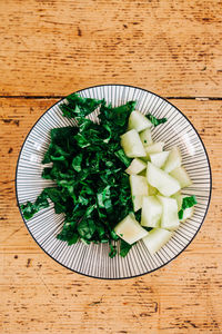 High angle view of vegetables in plate on table