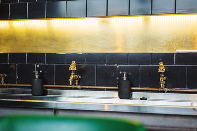 Close-up of faucet against wall