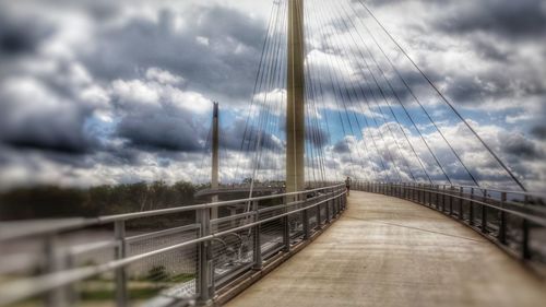 View of bridge against cloudy sky