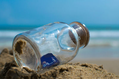 Memory card inside a glass bottle on the seashore