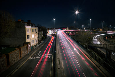 High angle view of light trails on city street at night