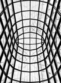 Low angle view of skylight through windows 