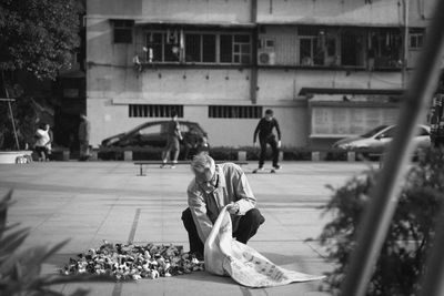 People playing in front of building