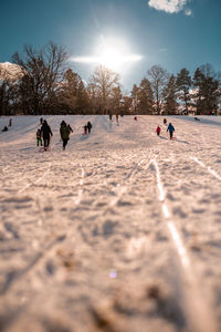 Group of people on snow covered field