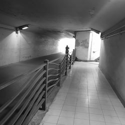 Man riding motorcycle in illuminated tunnel