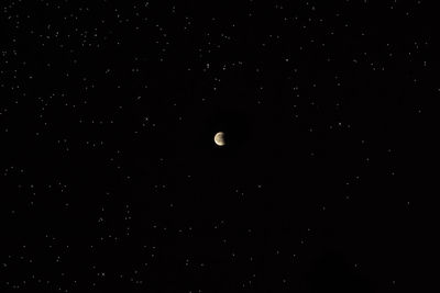 Low angle view of moon against sky at night