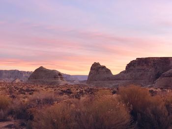 Scenic view of mountains against sky at sunset