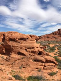 Rock formations on landscape against sky